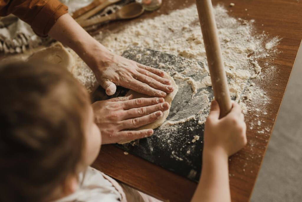 hands kneading dough